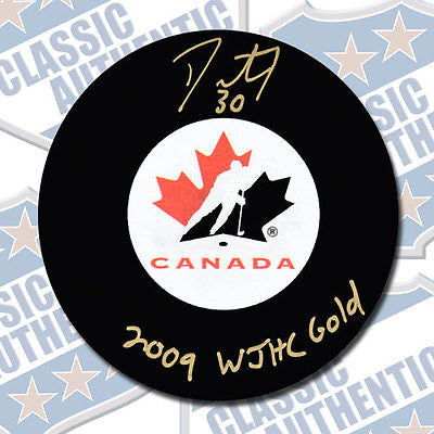 DUSTIN TOKARSKI Team Canada autographed puck w/2009 WJHC Gold (#2879)