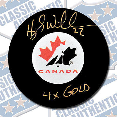 HAYLEY WICKENHEISER Team Canada autographed puck w/4x Gold (#2755)