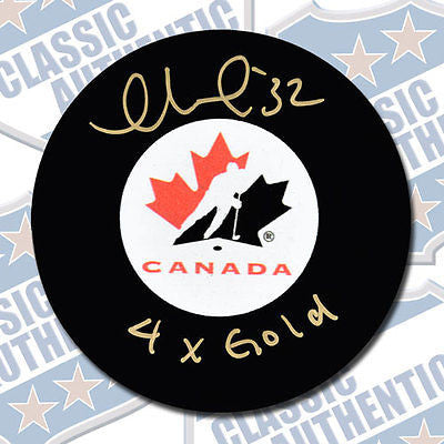 CHARLINE LABONTE Team Canada autographed puck w/4x Gold (#2874)