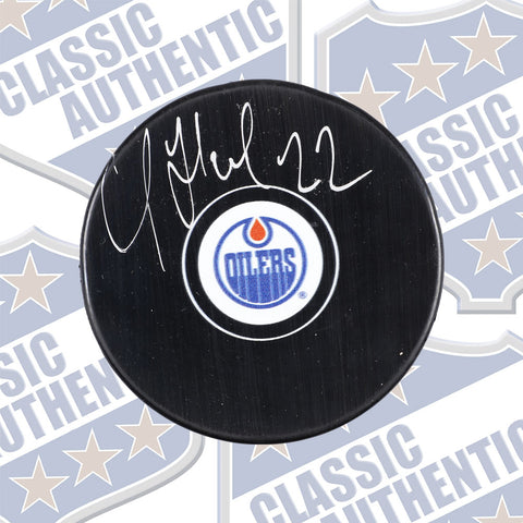 ROMAN HAMRLIK Edmonton Oilers autographed puck (#718)