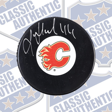 ROMAN HAMRLIK Calgary Flames autographed puck (#724)