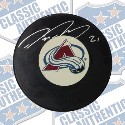 PETER FORSBERG Colorado Avalanche autographed puck (#666)