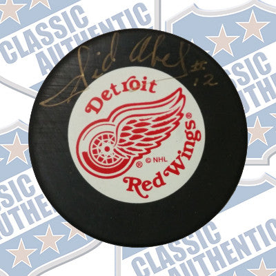 SID ABEL Detroit Red Wings autographed puck (#608)