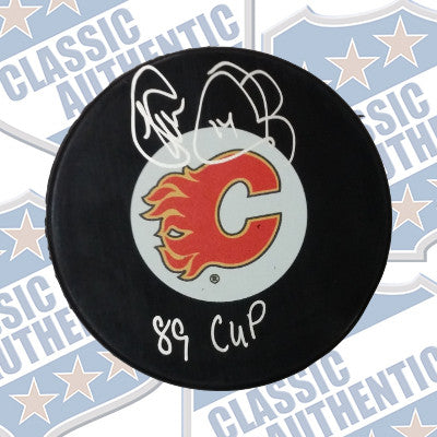 THEO FLEURY Calgary Flames autographed puck (#9200)